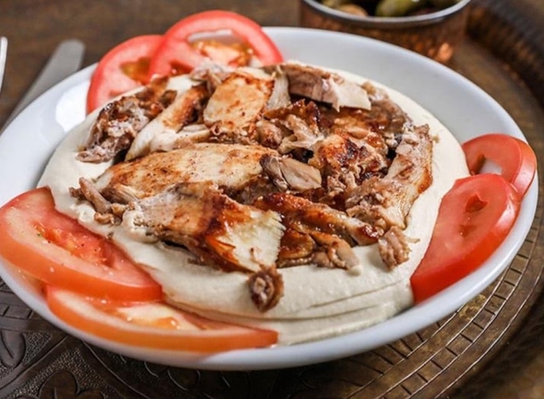 Hummus topped with chicken shawarma